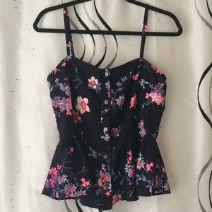Cute floral tank. Buttons and peplum detail!!!